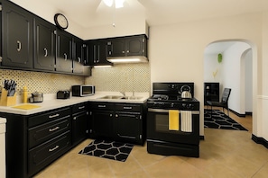 Mini-fridge, microwave, stovetop, cookware/dishes/utensils