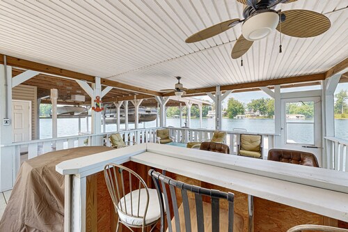 Relaxing lakeside retreat with boathouse, dock, deck, firepit and screened porch