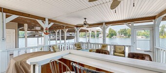 Relaxing lakeside retreat with boathouse, dock, deck, firepit and screened porch