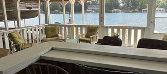Relaxing lakeside retreat with boathouse, dock, deck, firepit and screened porch