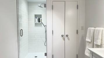 Shower, hair dryer, towels, soap