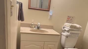 Shower, towels, soap, toilet paper