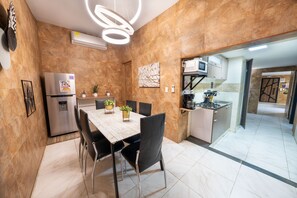 Fridge, microwave, stovetop, coffee/tea maker