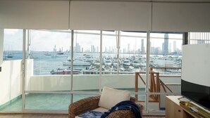 A balcony with a view of a marina and city skyline. - Casa Ramona Boutique Rooms (Cartagena)