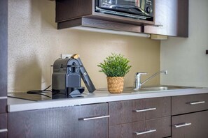 Fridge, stovetop, toaster, cookware/dishes/utensils