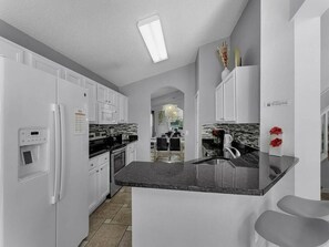 Fridge, microwave, oven, stovetop - 5BR Pool Home Near Disney (Kissimmee)