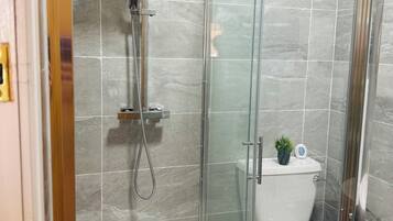 Shower, hair dryer, towels, soap