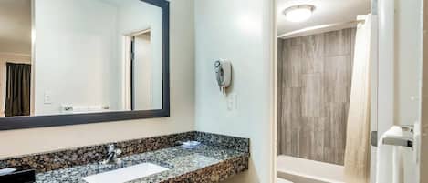 Basic Room, 1 King Bed | Bathroom | Hair dryer, towels, soap, shampoo