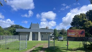 A building with a sign for a 'Sunset Retreat'.
