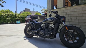 A motorcycle parked in a driveway.