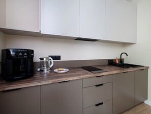 Fridge, microwave, stovetop, coffee/tea maker