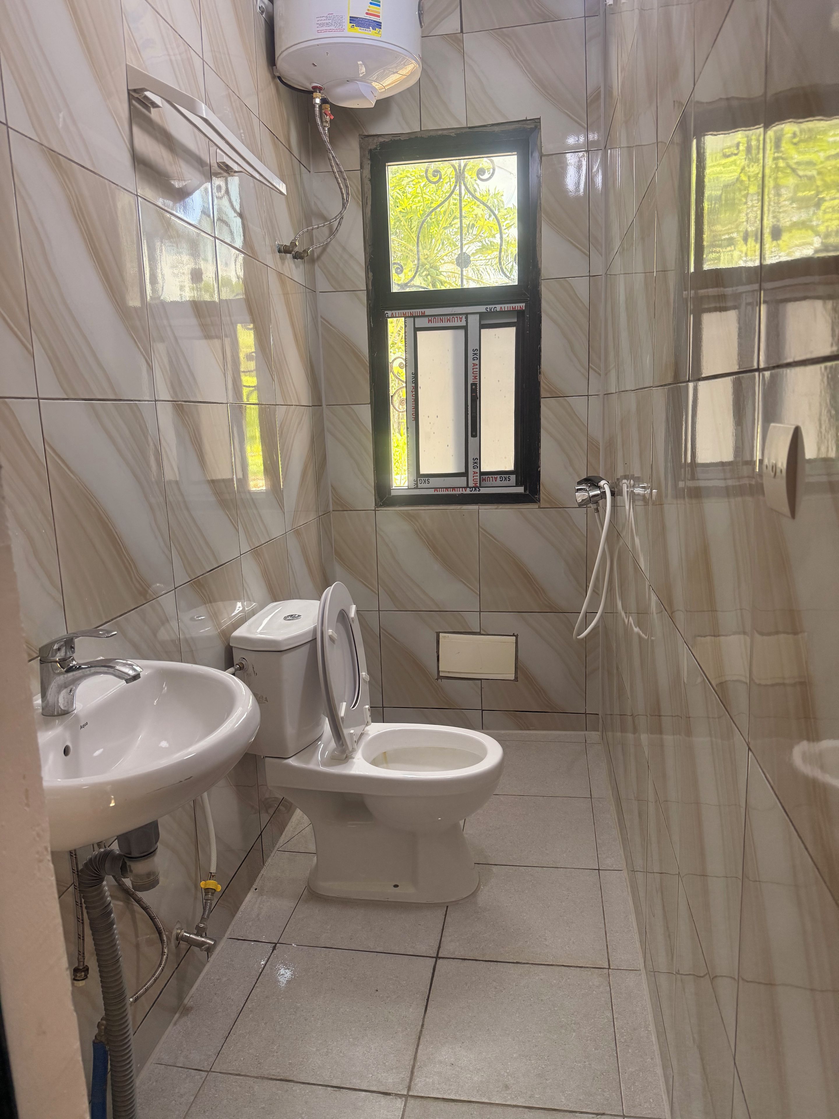 Bidet, towels, soap, toilet paper