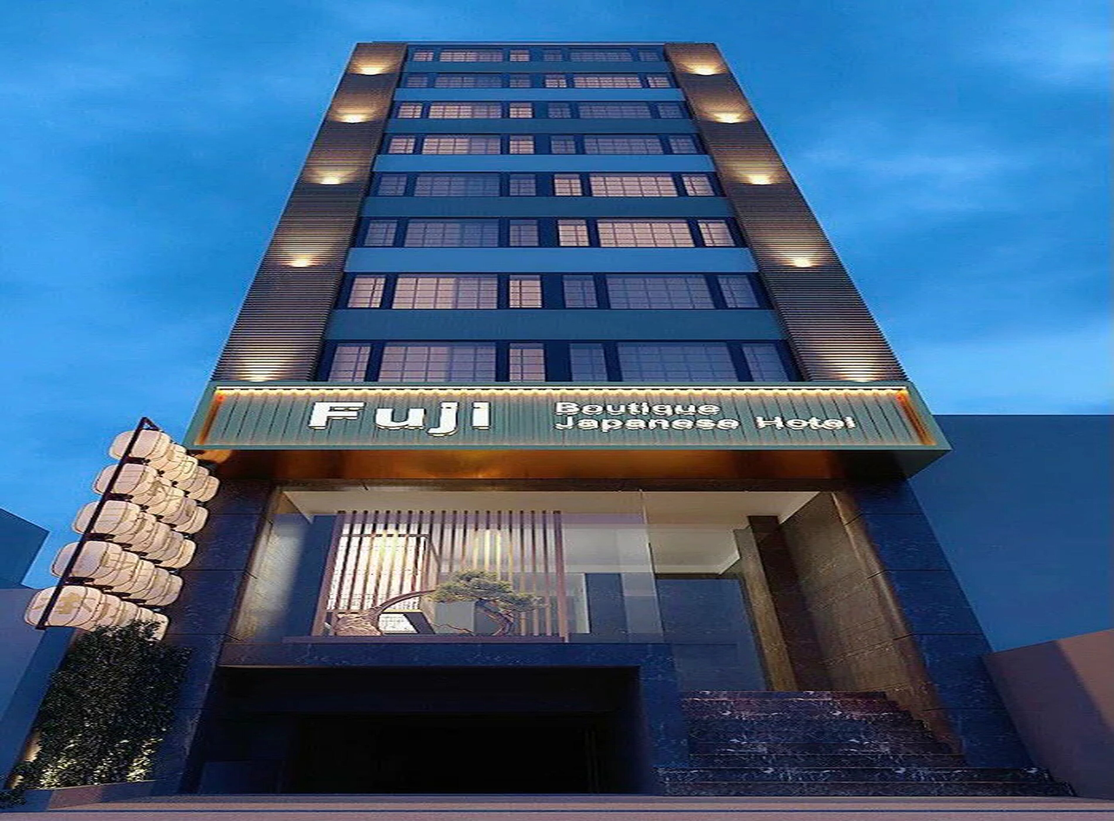 A tall building with a sign for 'Fuji Boutique Japanese Hotel' at the entrance.
