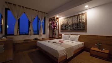 Habitación doble Deluxe, vista al océano | Ropa de cama de alta calidad, camas con pillow-top y minibar