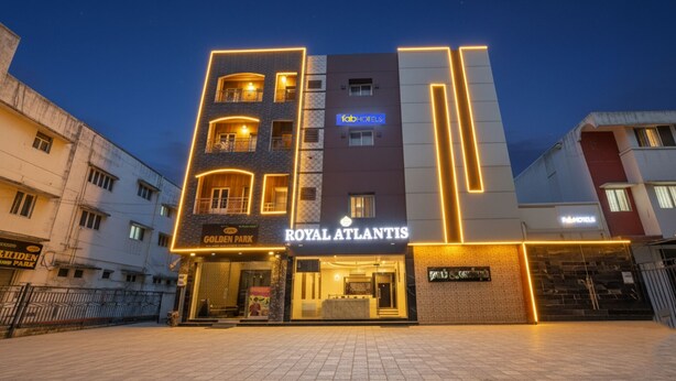 A hotel named "Royal Atlantis" with a modern design, featuring a prominent entrance and multiple balconies.