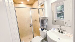 Shower, hair dryer, towels, soap