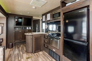 Fridge, microwave, stovetop, cookware/dishes/utensils