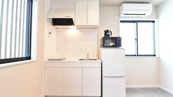 Fridge, microwave, cookware/dishes/utensils