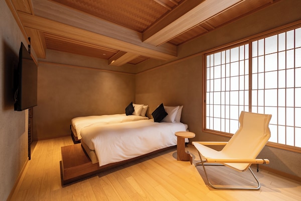 Premium Room | Living room | 50-inch flat-screen TV with digital channels