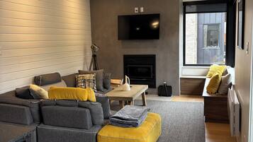 Smart TV, fireplace, table football, books