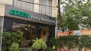 A restaurant named "Green Valley Restaurant" with a Coca-Cola sign on the wall. - Green Valley Palace (Bhopal)