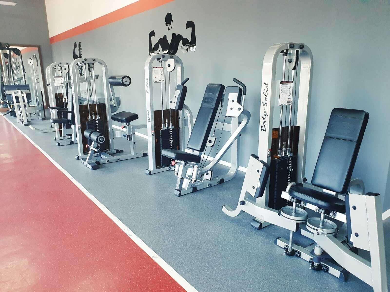 A row of gym equipment in a fitness center.