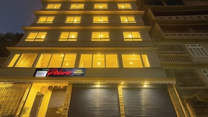 A hotel with multiple floors, a sign indicating it has rooms and a restaurant, and a closed entrance. - TVD Hotel Polaris Near Mg Marg (Gangtok)