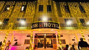 A hotel entrance with a sign reading "SR HOTEL" and a decorative floor pattern. - S R HOTEL (Varanasi)