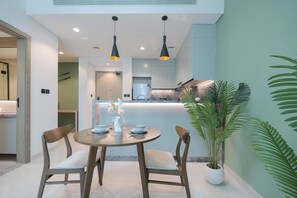 Deluxe Apartment, Balcony | In-room dining - KeyRock Living - Luxe Escape with Pool (Dubai)