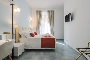 Superior Triple Room, City View | In-room safe, desk, laptop workspace, blackout drapes