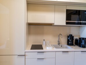 Fridge, microwave, cookware/dishes/utensils