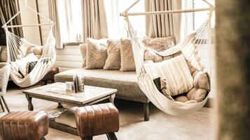 Suite, Balcony, Garden View | Living area | TV