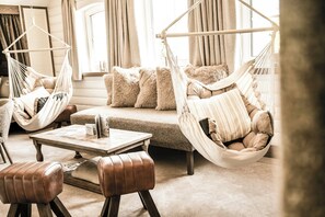 Suite, Balcony, Garden View | Living area | TV