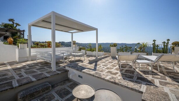 A rooftop terrace with a pergola, seating area, and a view of the landscape. - Il Palazzotto: elegant historic residence in the heart of Ostuni with panoramic (Ostuni)