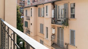 A multi-story building with balconies, air conditioning units, and shutters. - GuestHost - Milan City Studies Balcony Apt (Milan)