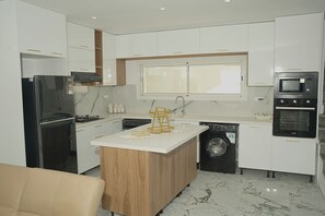 Fridge, microwave, oven, dining tables