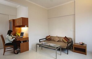 Deluxe Room, City View | In-room safe, desk, laptop workspace, iron/ironing board - AVION HOTEL (Mumbai)