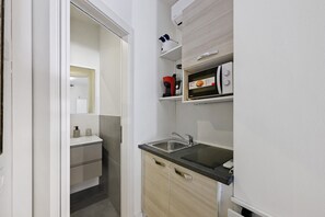 Fridge, coffee/tea maker, cookware/dishes/utensils