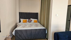 Desk, laptop workspace, blackout curtains, free WiFi