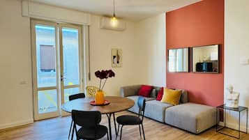 Design Apartment, 2 Bedrooms, Balcony, Courtyard View | Living area | Flat-screen TV