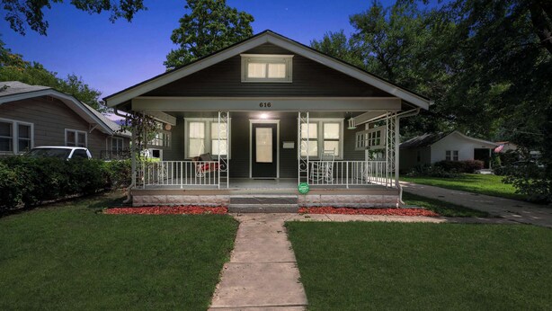 A two-story house with a front porch, number 616, surrounded by well-maintained lawns and trees. - 2 Bed 1 Bath home by College Hill and Hospitals (Wichita)