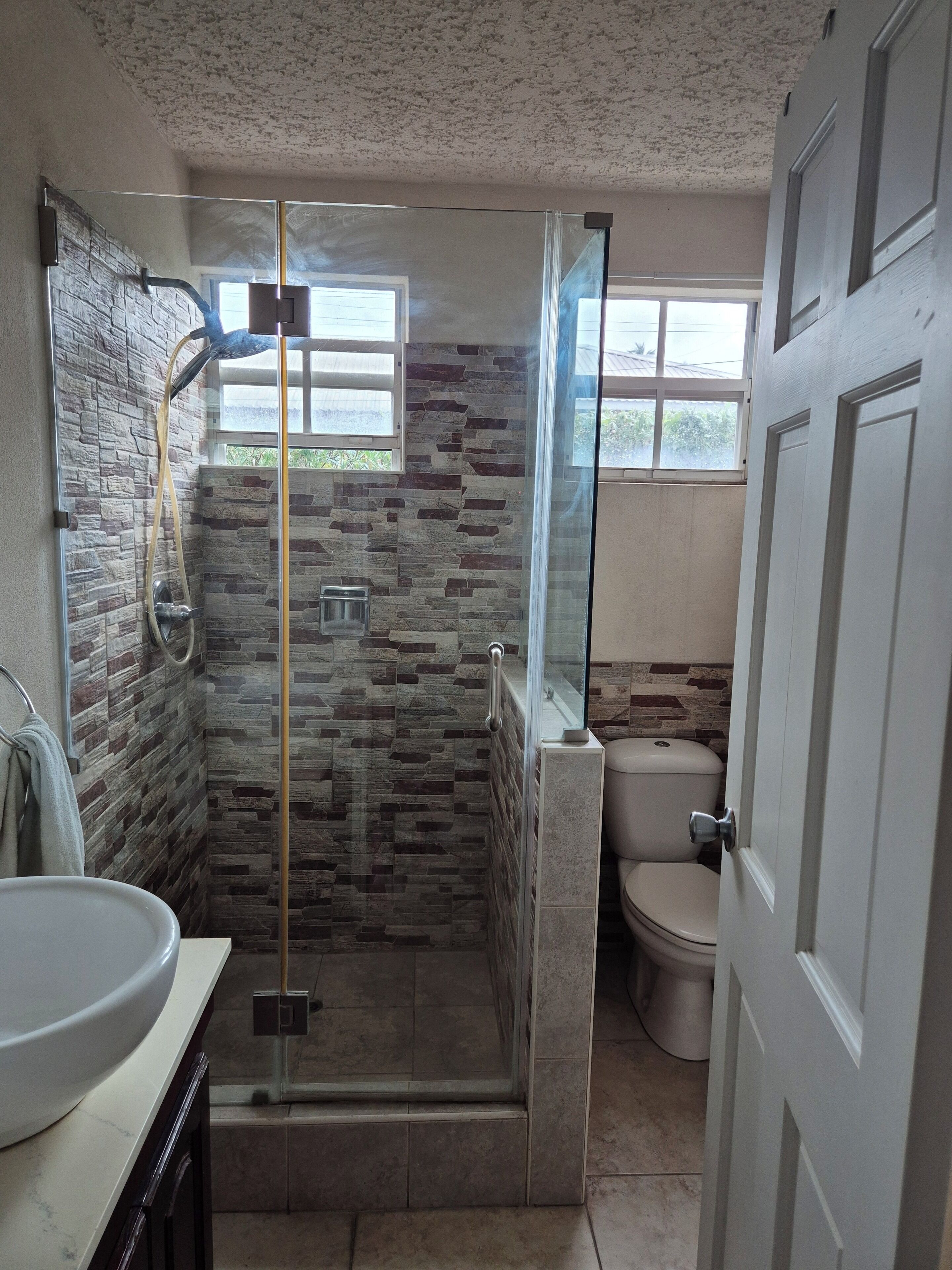 Shower, towels, soap, toilet paper