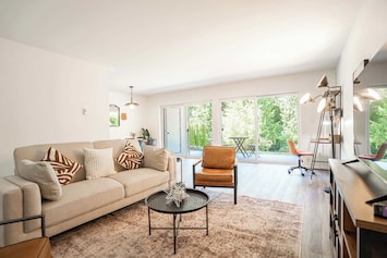 Cozy living room with easy access to the backyard for relaxing and fresh air.