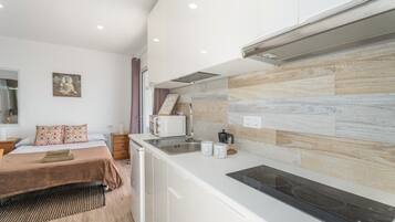 Fridge, microwave, stovetop, coffee/tea maker