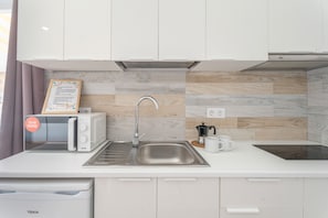 Fridge, microwave, stovetop, coffee/tea maker