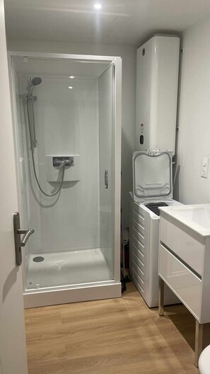 Shower, hair dryer, towels, toilet paper