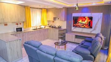 Family Apartment | Living area | 32-inch Smart TV with digital channels