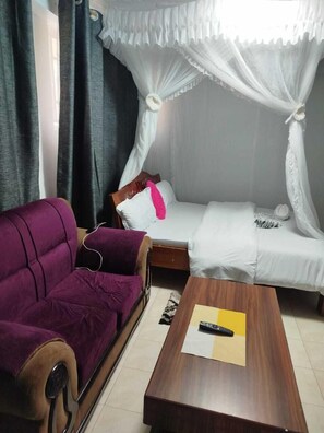 Deluxe Studio, City View | Living area | 32-inch Smart TV with digital channels - Tulips Apartments Naivasha (Naivasha)