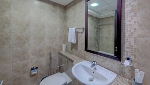 A bathroom with a sink, toilet, and shower. - Newly launched studio (Dubai)
