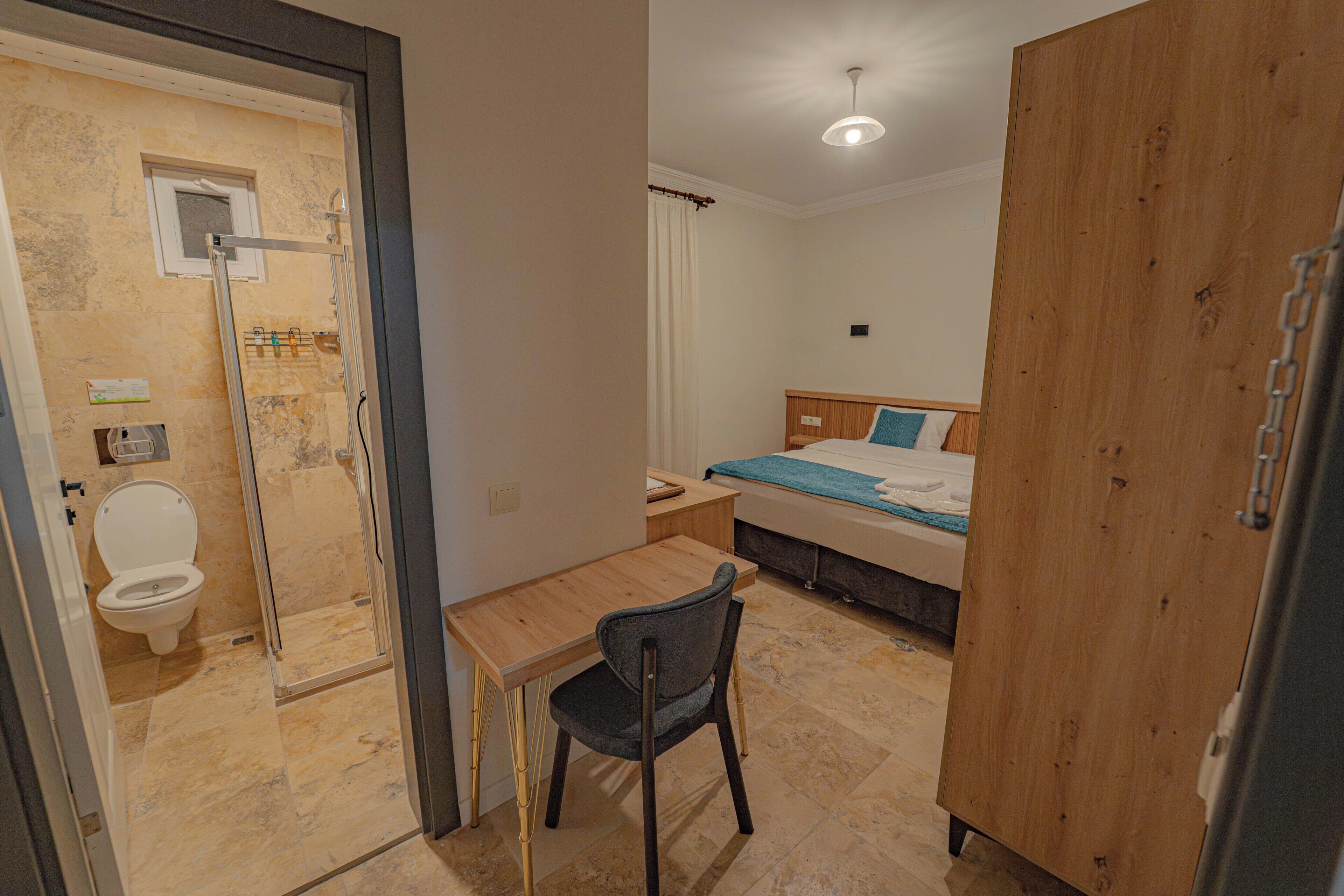 Desk, laptop workspace, free WiFi, bed sheets